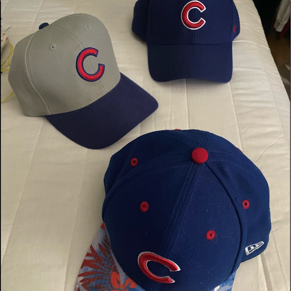 Three Chicago Cubs hats. You get all 3.